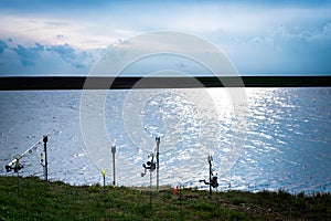 Fishing rods at the edge of a lake