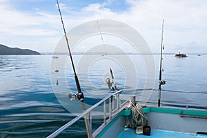 Fishing rods on a charter boat at sea in Far North District, Nor