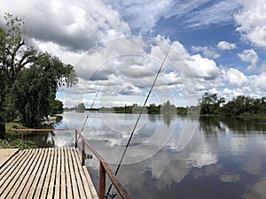 Fishing rods on the river bank