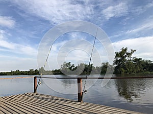 Fishing rods on the river bank