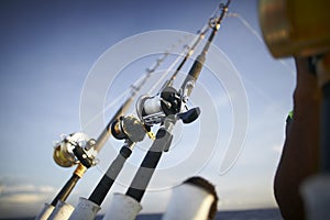 Fishing rods from towing boat photo