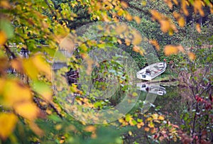 Fishing rowboat parked along the lake shore. photo