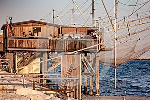 Fishing scales Sottomarin mare along the marina dam, some of them equipped as a restaurant to appreciate what they collect, a fish