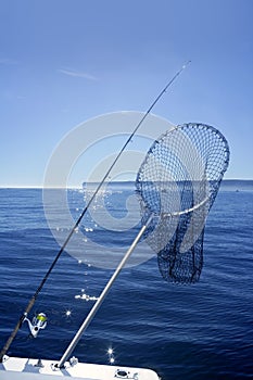 Fishing scoop net on boat in blue sea