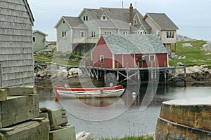 Fishing shack and boats in a cove of a fishing village Canada