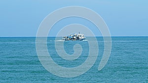 Fishing Ship In The Calm Sea. Fishing Boat Out In The Ocean Or Sea Wide. Real time.