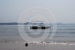 Fishing ship in the sea. South India, Village Colva or Kolva.