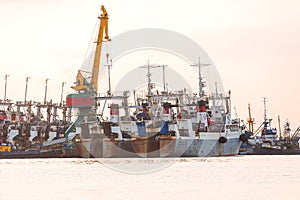 The fishing ships on a decline on a pier on Kamchatka