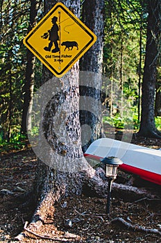 Fishing sign and kayak at lake