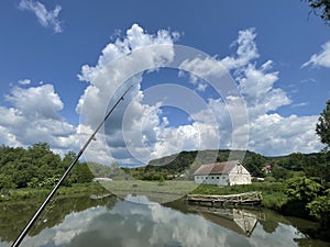 Fishing on a small lake on the Transylvanian hills in Transylvania, Romania