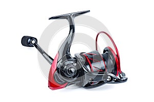 Fishing spining reel red and black color isolated on white photo