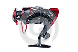 Fishing spining reel red and black color isolated on white background photo