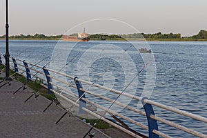 Fishing spinning on the embankment of the Dnipro River in Kherson at sunset. Ukraine