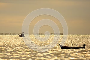 Fishing squid boat start working on middle sea at twilight time, life style