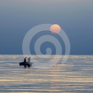 Fishing at sunrise