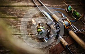 Fishing tackle composition, wood background.