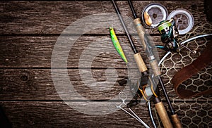 Fishing tackle composition, wood background.