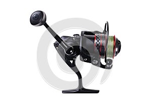 Fishing tackle. Fishing reel with the line isolated on white background with clipping path. Modern fishing reel isolated. Empty sp