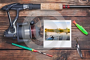 Fishing tackle and a photo of successful fishing