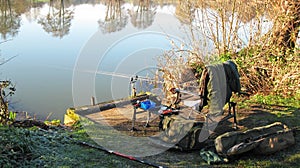 Fishing tackle on the side of a river.