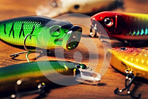 Fishing tackle - variety of wobbler lures on wooden background