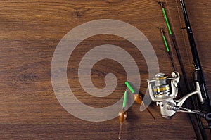 Fishing tackle on the wooden background