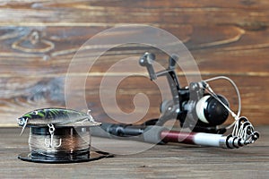 Fishing tackle on wooden board