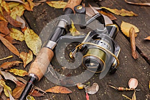 Fishing tackle on wooden surface.