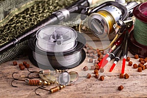 Fishing tackle on a wooden table.