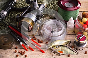 Fishing tackle on a wooden table.