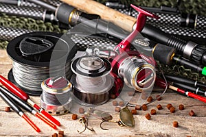 Fishing tackle on a wooden table.