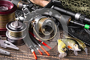 Fishing tackle on a wooden table.