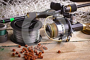 Fishing tackle on a wooden table.
