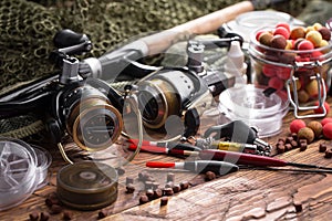 Fishing tackle on a wooden table.