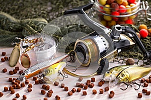 Fishing tackle on a wooden table.
