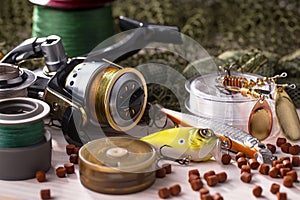 Fishing tackle on a wooden table.