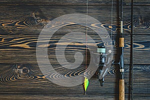 Fishing tackle on a wooden table. toned image