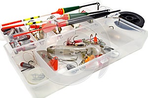 Fishing tools in storage box on white background