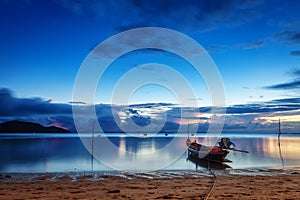 Fishing and touristic boats at sunset