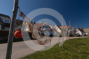 Fishing traps and nets in front of idyllic houses in Arild, Kullaberg, Sweden