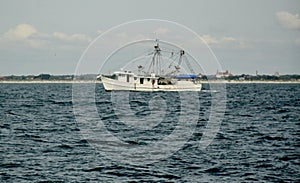 A Fishing Trawler Makes Its Way To The Ocean