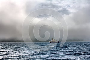 Fishing trawler during a storm