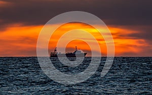 Fishing Trawler In Sunset