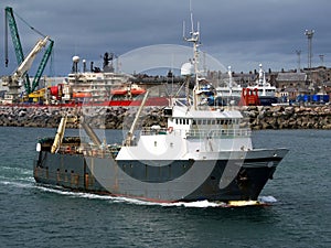 Fishing Trawler Underway Leaving Port.