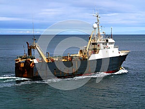 Fishing Trawler Underway at Sea photo