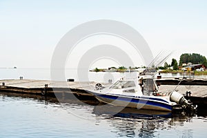 Fishing trolling boat on a forest lake, nature vacation unplugged