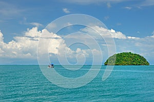 A fishing vessel on turquoise paradise sea near southern tip of the Koh Chang island, Thailand.