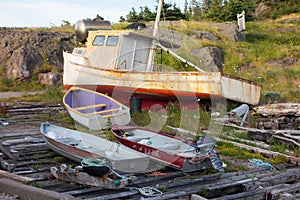 Fishing vessels pulled up on a makeshift ramp in the maritimes