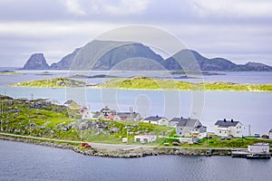 Fishing village GjesvÃ¦r with GjervÃ¦rstappan in the background, Finnmark, Norway