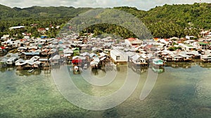 Fishing village and houses on stilts. Dapa city, Siargao, Philippines.